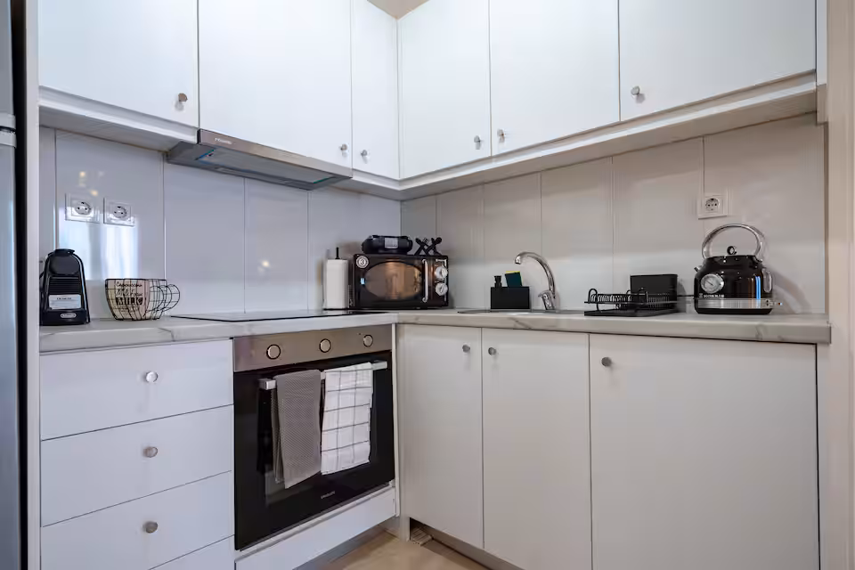 Kitchen with appliances and cookware
